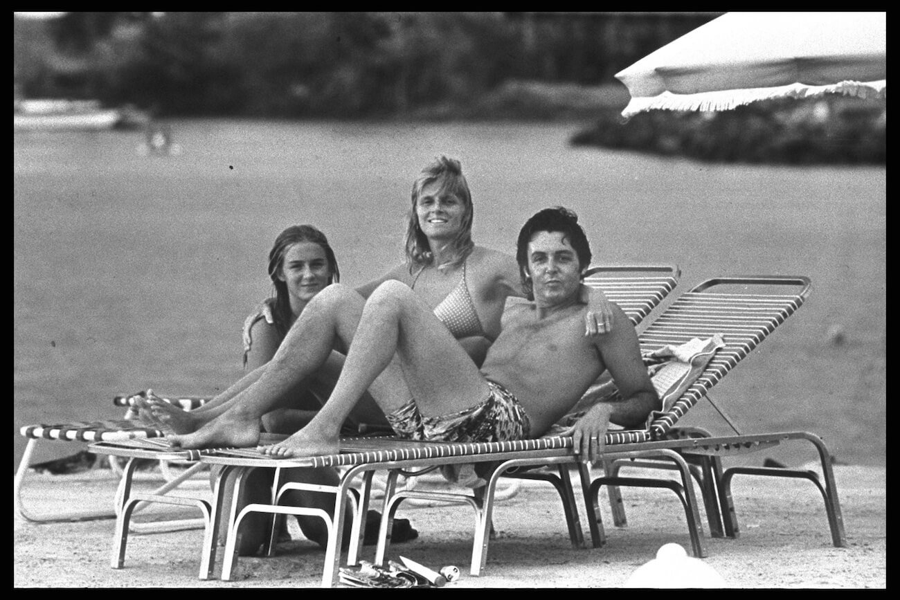 Paul McCartney with his wife, Linda, and his adopted daughter, Heather outside in the 1970s.