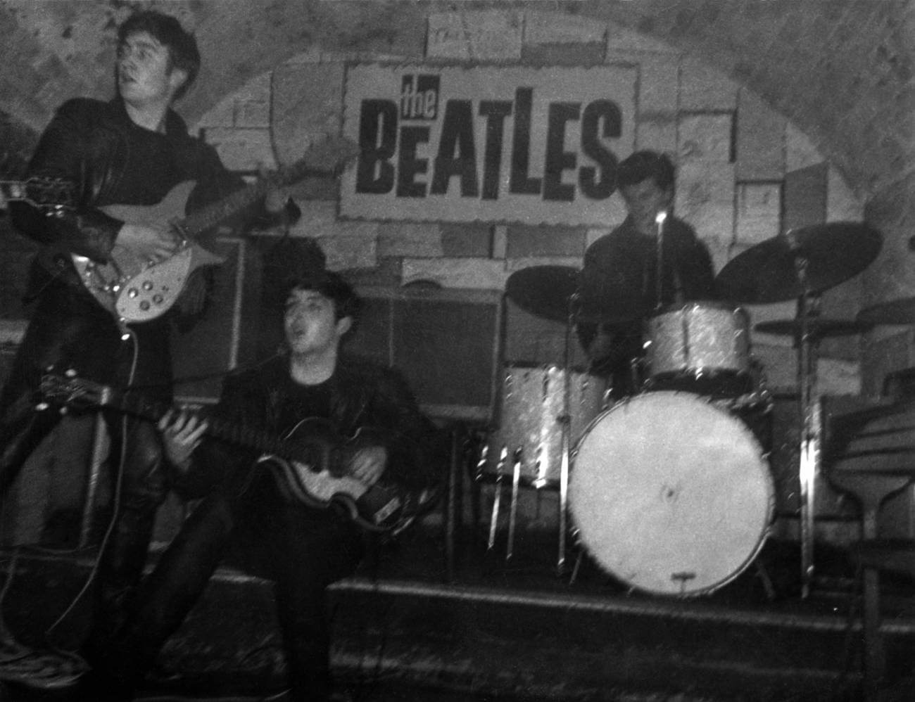 Paul McCartney performing with The Beatles at The Cavern Club in the early 1960s.