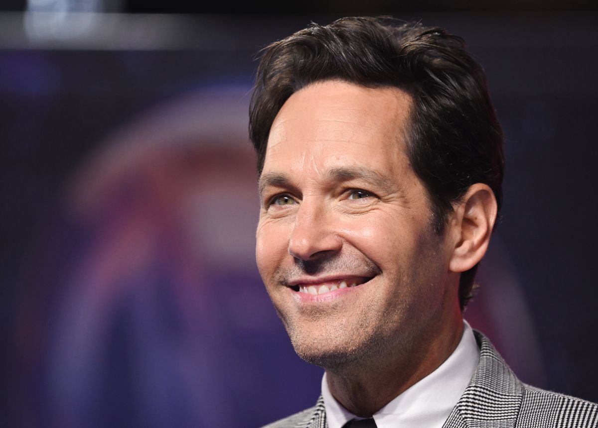 Paul Rudd smiles for photos at an event promoting "Ant-Man and the Wasp: Quantumania"