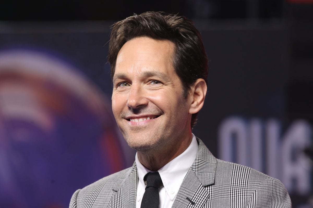 Paul Rudd smiles for photos at an event promoting the newest "Ant-Man" film.