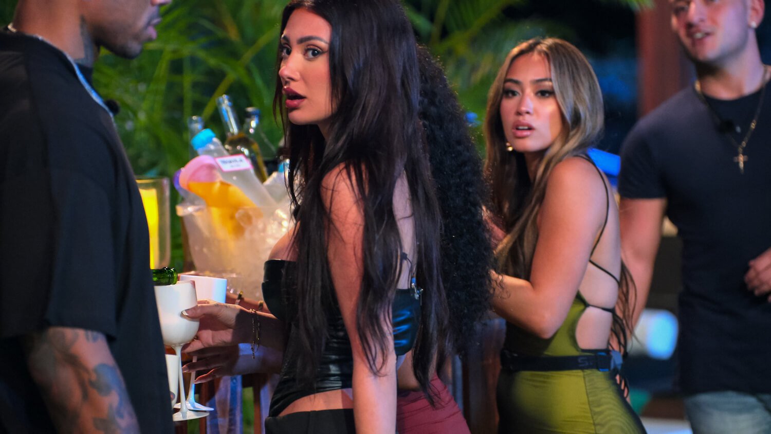 'Perfect Match' stars Savannah and Francesca continue to battle it out on social media. The two are seen here standing next to the villa bar in a production still from the series.