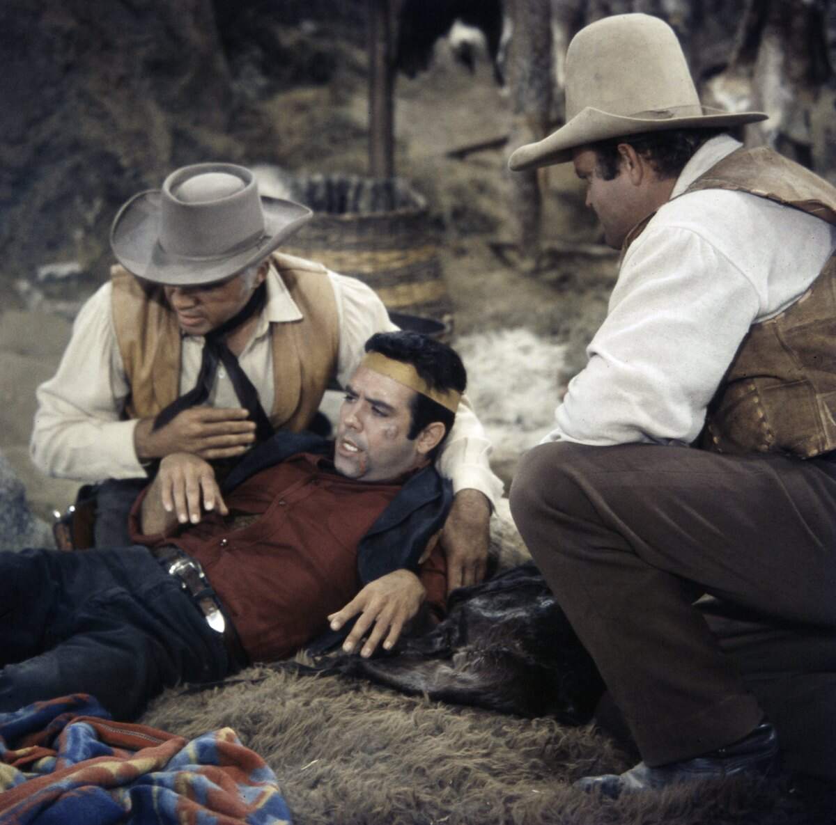 Lorne Greene as Ben Cartwright, Pernell Roberts as Adam Cartwright, and Dan Blocker as Eric 'Hoss' Cartwright film a Bonanza episode