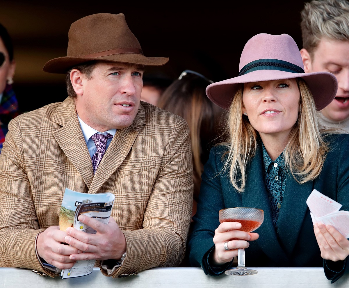 Peter Phillips and Autumn Phillips watch the racing as they attend day 4 'Gold Cup Day'