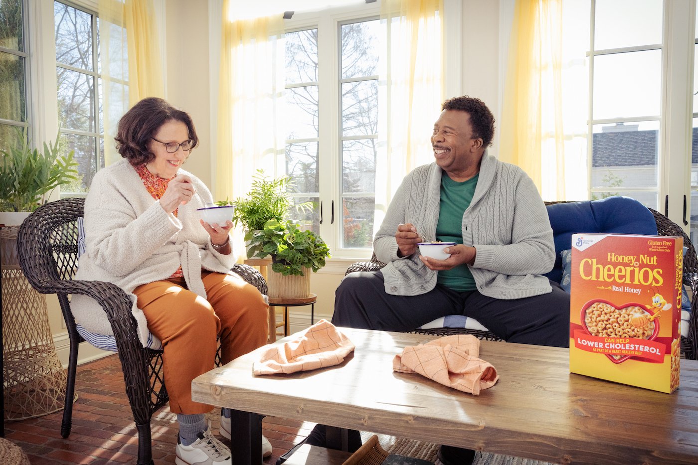 'The Office' actors Leslie David Baker, who played Stanley, and Phyllis Smith, who played Phyllis, sit at a table and have a bowl of cereal