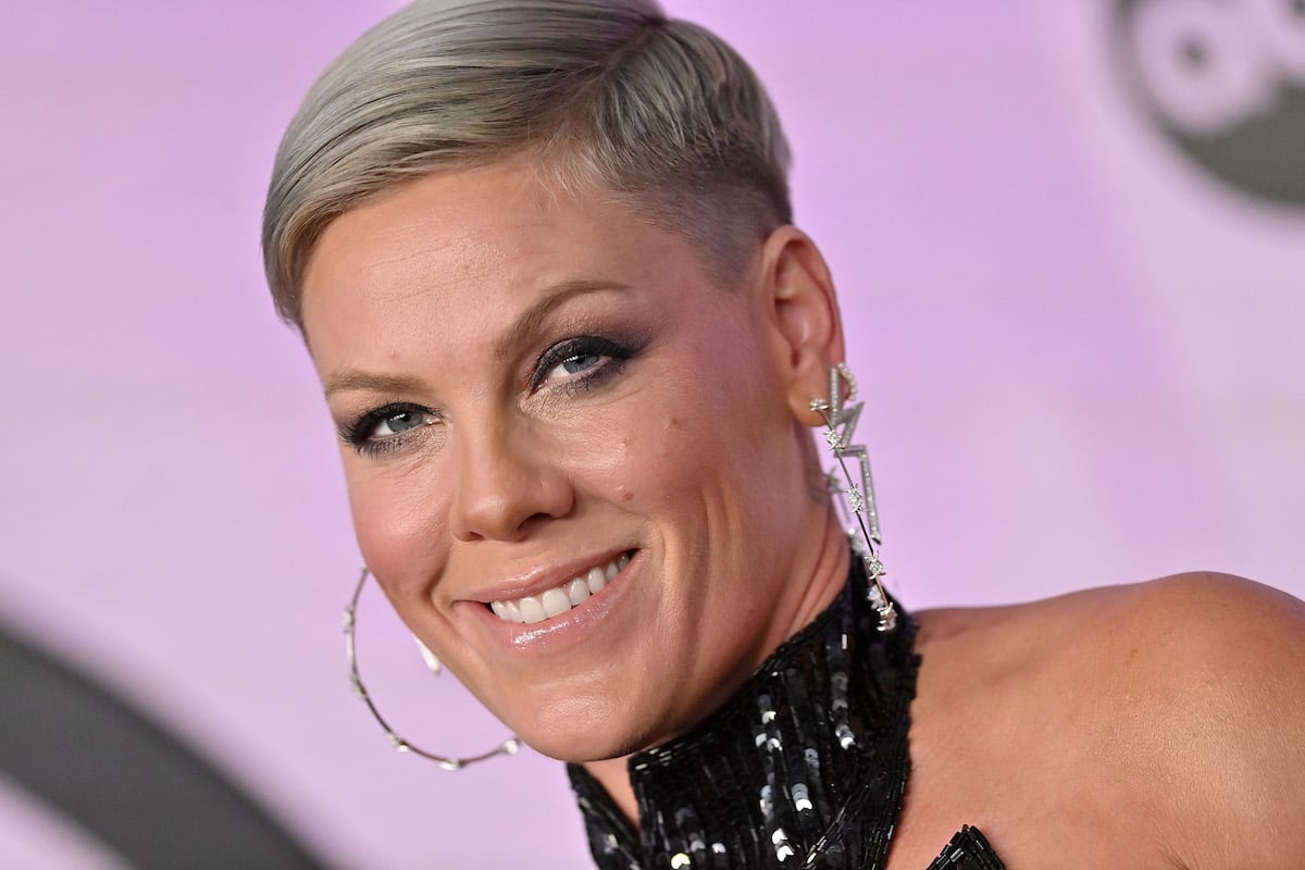 Pop rock singer Pink smiles and poses at an event.