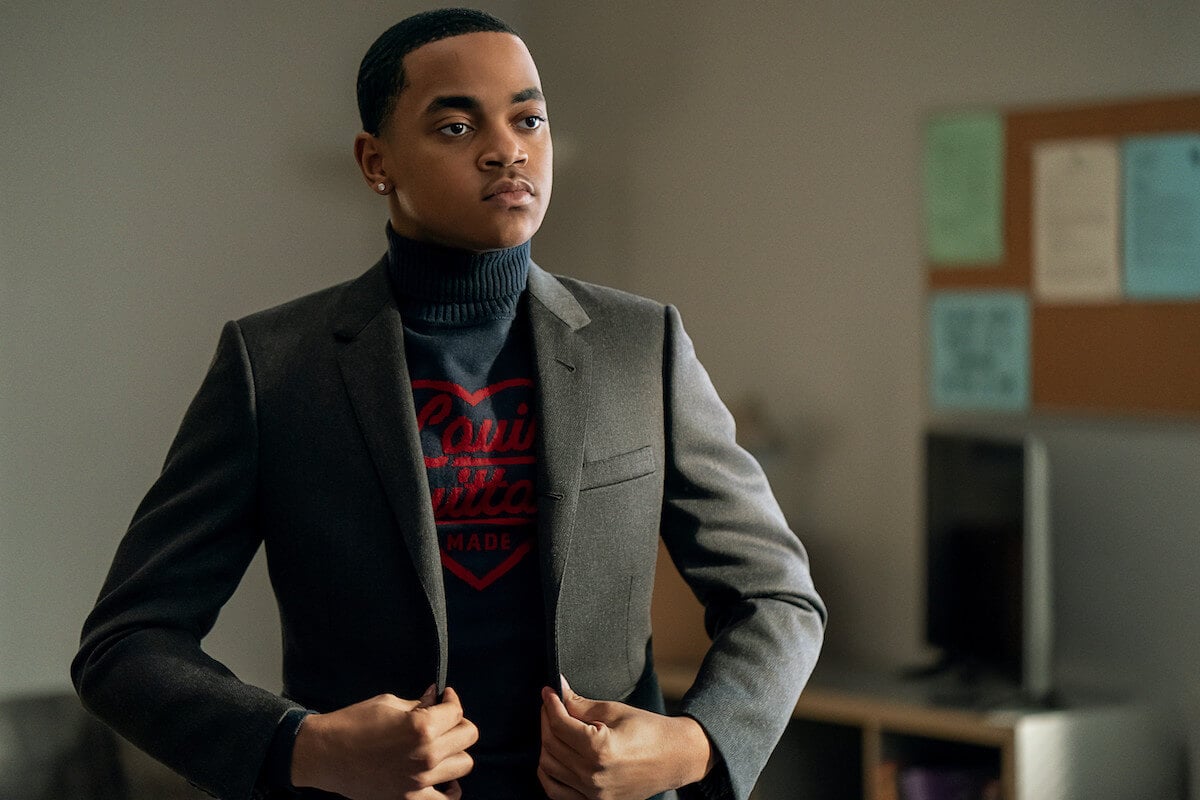 Michael Rainey Jr. as Tariq St. Patrick holding his blazer closed in 'Power Book II: Ghost'