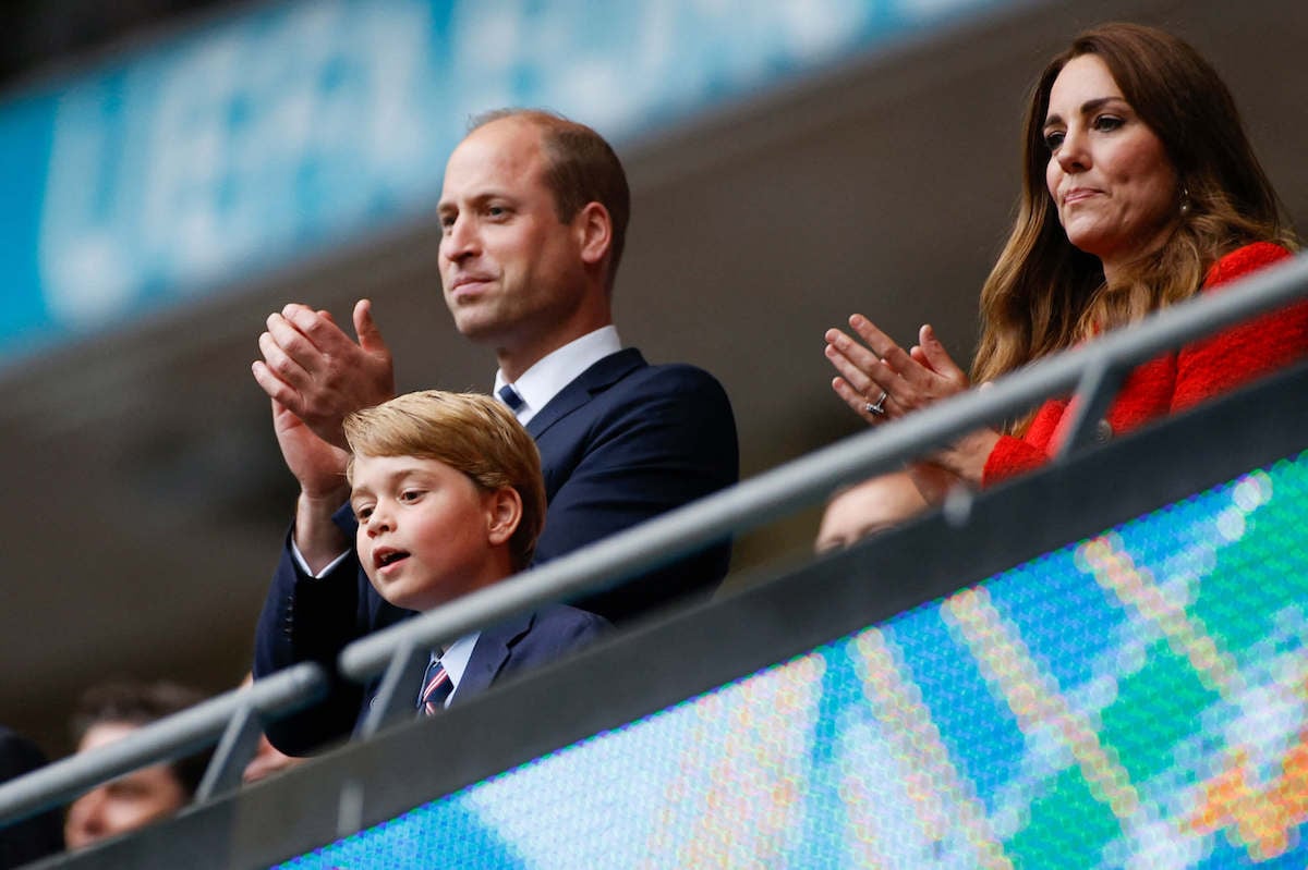 Prince William and Prince George, whom a historian predicts will be seen 'a lot' at King Charles' coronation stand with Kate Middleton