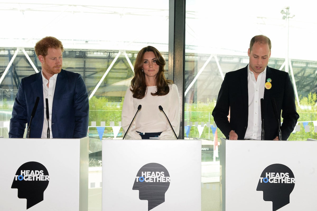 Prince Harry stands next to Kate Middleton and Prince William, who he claimed in 'Spare' teased him about his anxiety