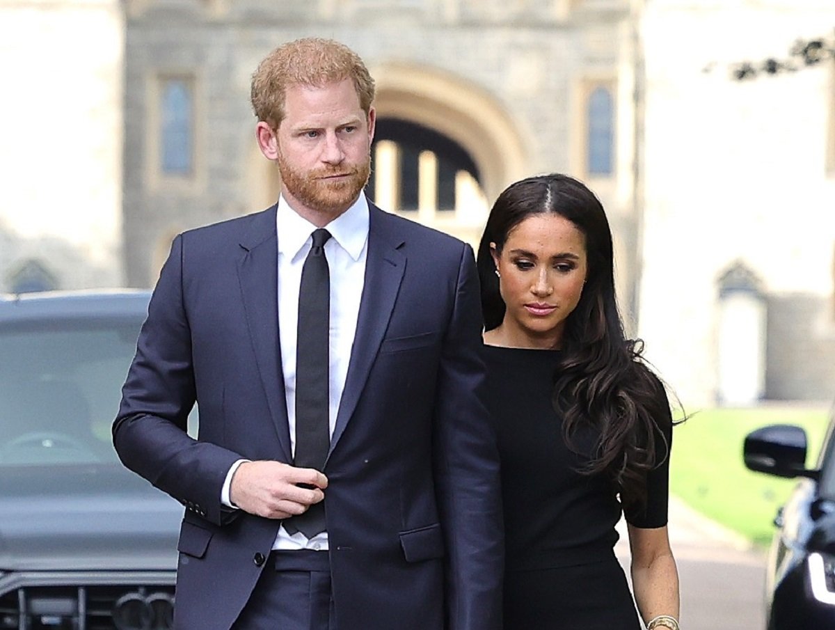 Prince Harry and Meghan Markle arrive on the long Walk at Windsor Castle arrive to view flowers and tributes to Queen Elizabeth II