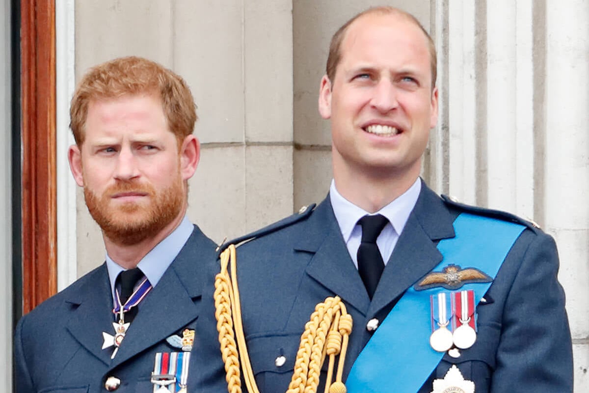 Prince Harry, who looked 'superior' discussing his brother's baldness, according to a body language expert, stands behind Prince William