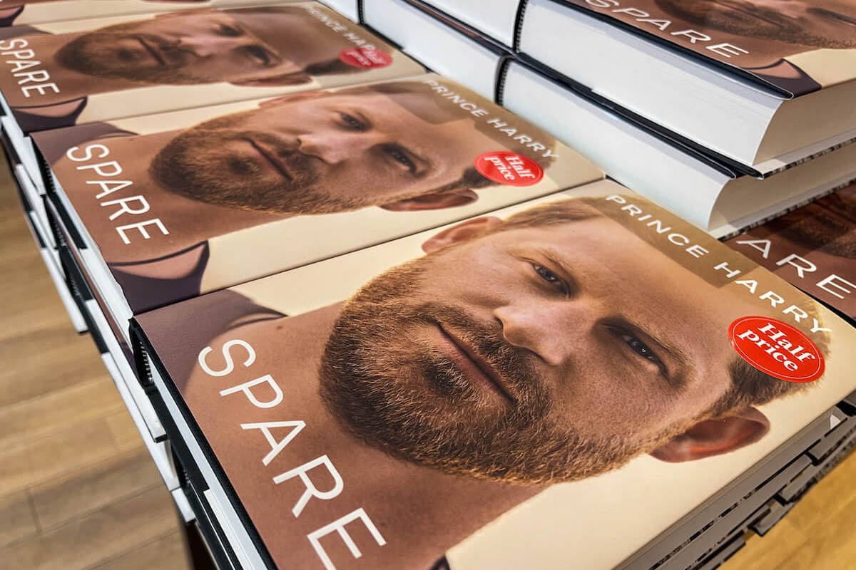 Copies of Prince Harry's 'Spare' memoir, which the royal family hasn't commented on, sit on a table