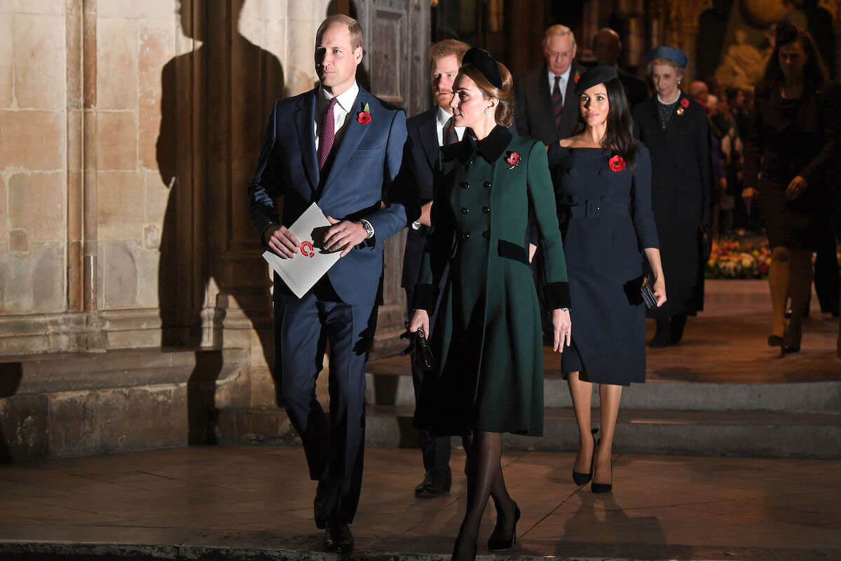 Meghan Markle, who told Prince William to 'kindly take your finger out of my face' per 'Spare,' walks with Prince William, Kate Middleton, and Prince Harry