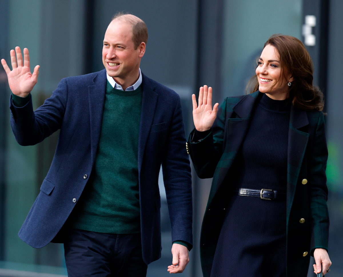 Prince William and Kate Middleton smile and wave.