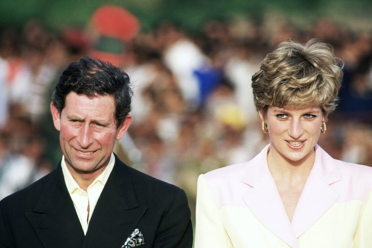 King Charles and Princess Diana walking side by side.