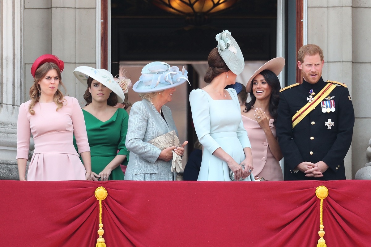 Princess Eugenie, Princess Beatrice, Meghan Markle, Prince Harry, and other royals standing on the balcony of Buckingham Palace during Trooping The Colour 2018
