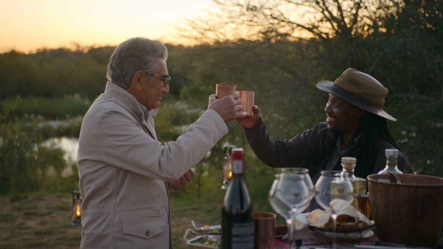 'Reluctant Traveler' Eugene Levy toasts with his South African guide