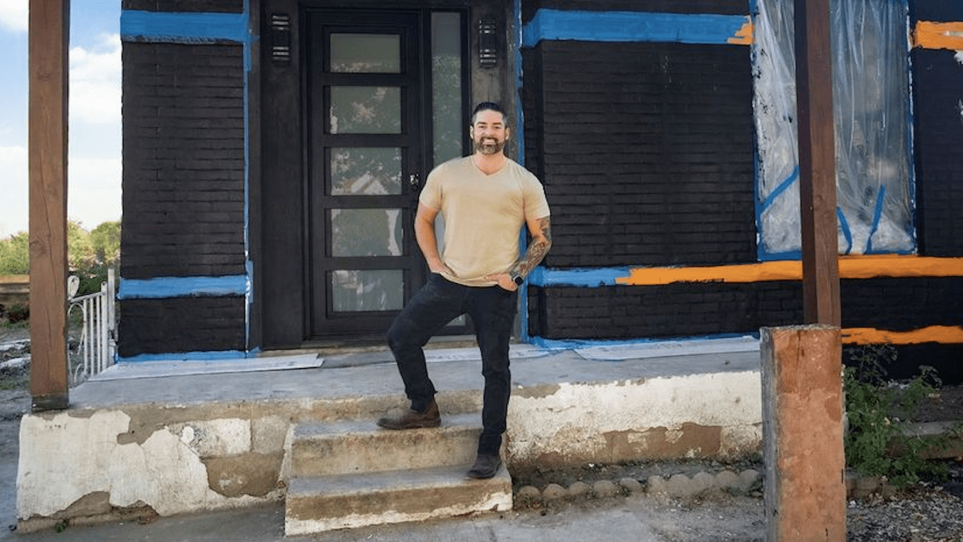Rico León from 'Rico to the Rescue' stands outside an unfinished home 