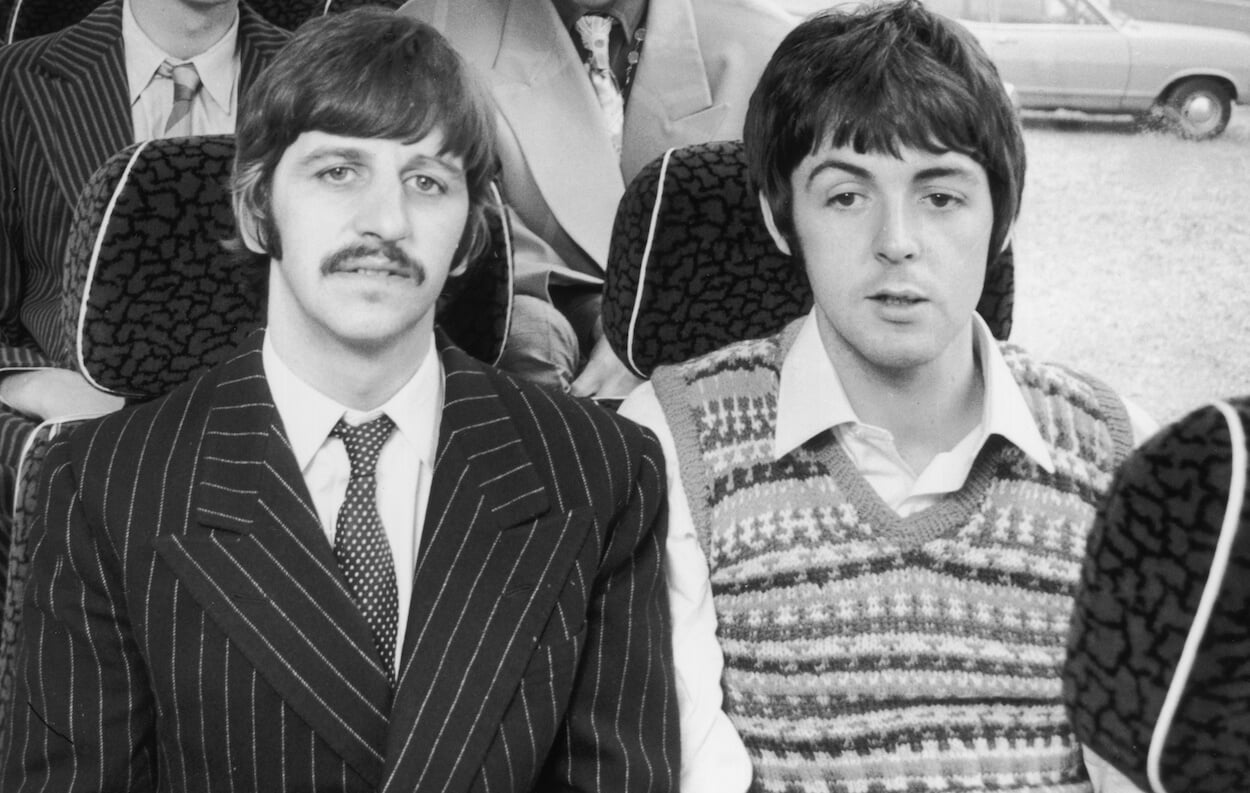 Ringo Starr (left) and Paul McCartney sit on a bus on their way to film 'Magical Mystery Tour' in 1967