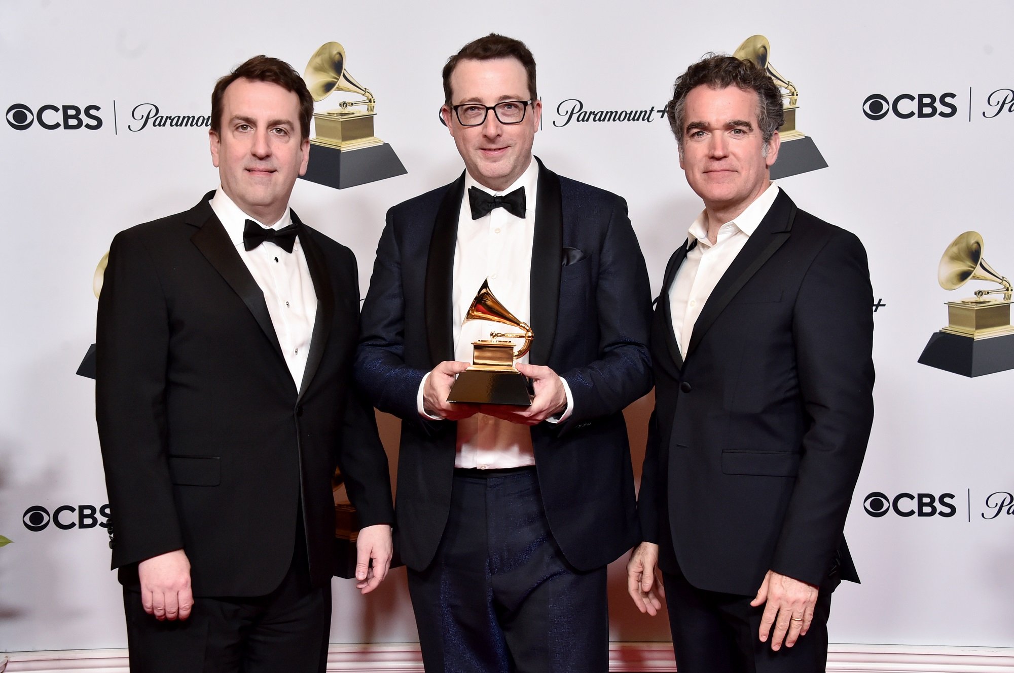 Rob Berman, Sean Patrick Flahaven and Brian d'Arcy James pose with a Grammy Award