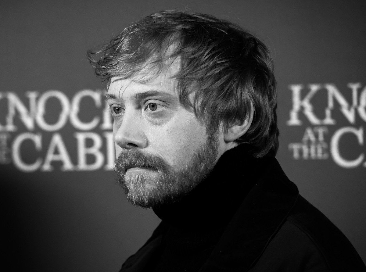 A black and white image of Rupert Grint's face.