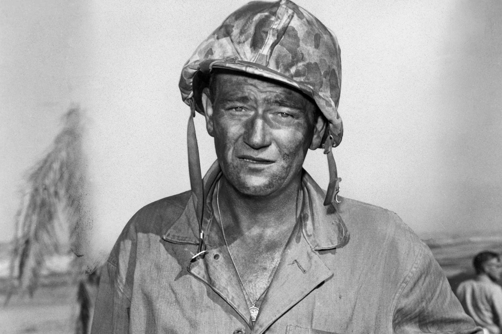 'Sands of Iwo Jima' John Wayne as Sgt. John M. Stryker looking ahead in a black-and-white picture wearing his Army uniform