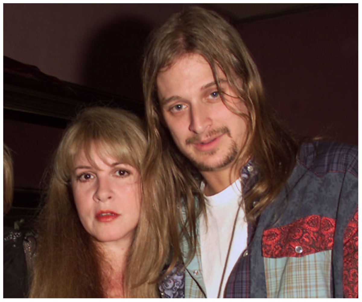 Stevie Nicks and Kid Rock pose together.