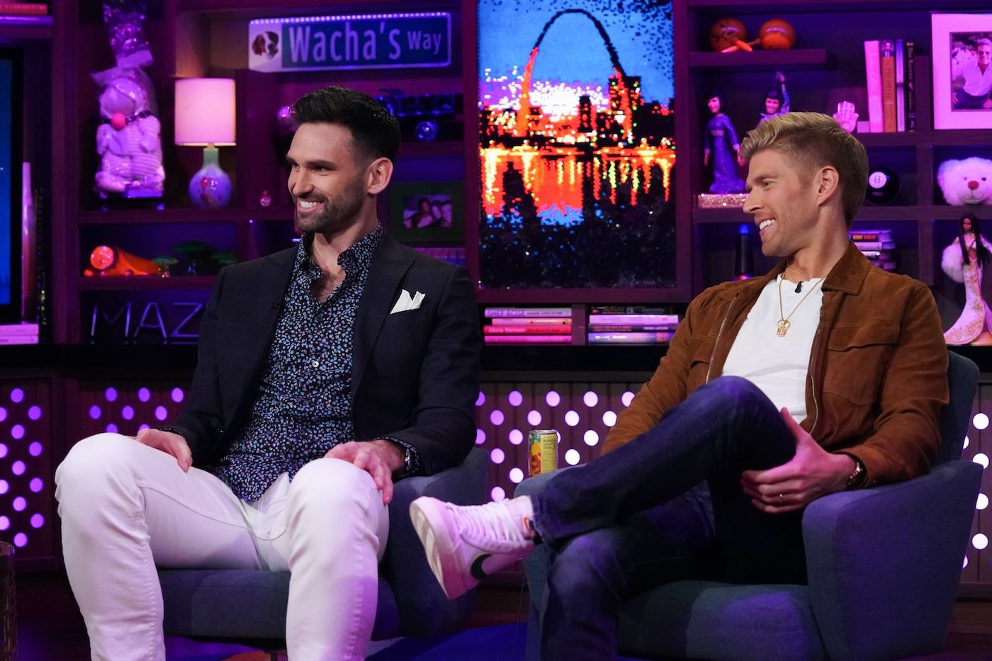 Carl Radke and Kyle Cooke from 'Summer House' sit in chairs on 'WWHL'