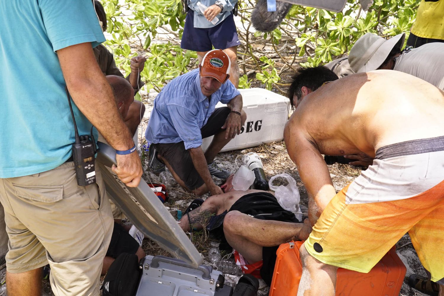 Jeff Probst, the Medical Team, and Nick Maiorano assess the condition of Caleb Reynolds on the beach during 'Survivor' Season 32 Episode 4, which ultimately ended in Caleb's medical evacuation from the show.