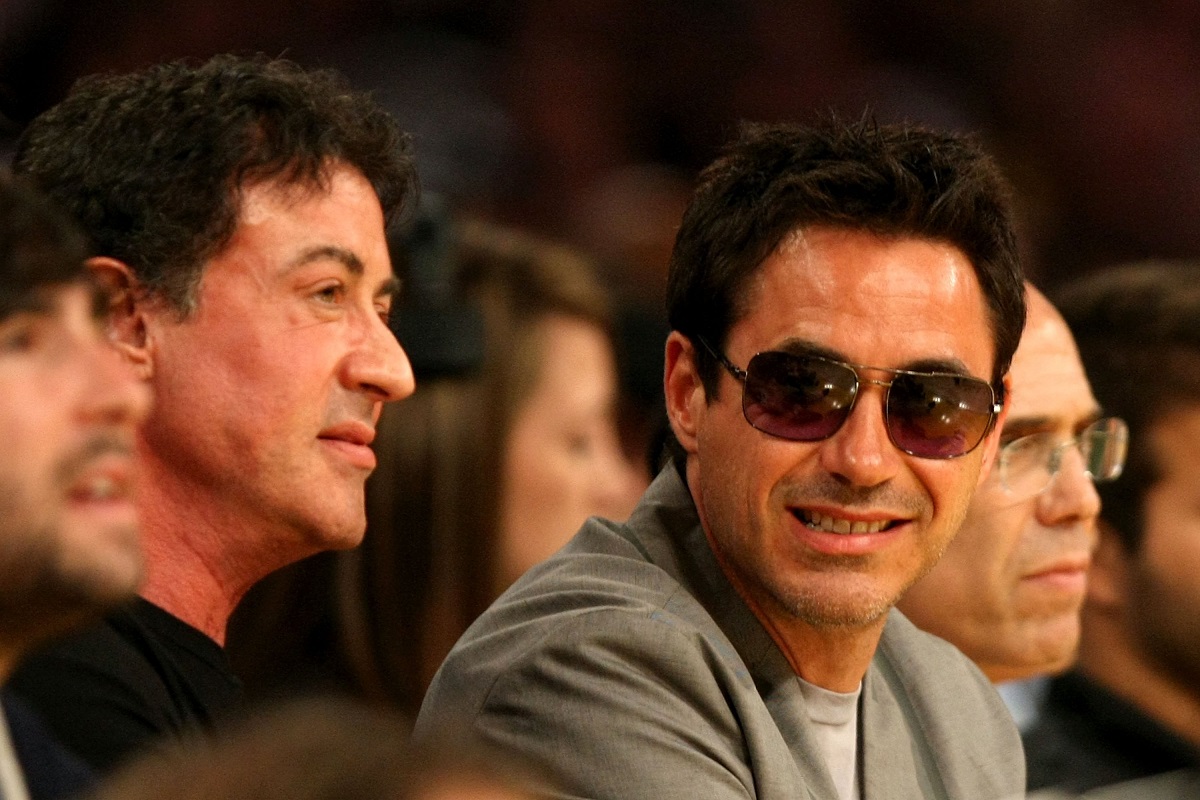 Sylvester Stallone and Robert Downey Jr. at a basketball game.