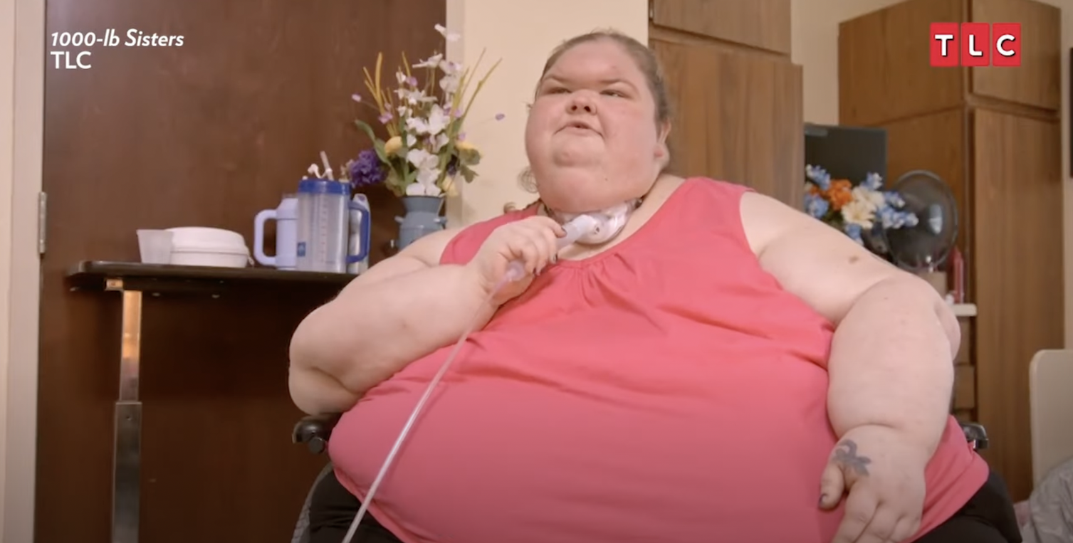 Tammy Slaton from '1000-Lb. Sisters' Season 4 sitting in a wheel chair in a pink shirt