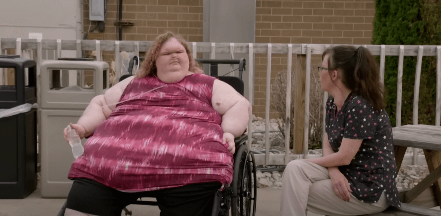 Tammy Slaton from '1000-Lb. Sisters' Season 4 sitting in a wheelchair outside while speaking to a woman