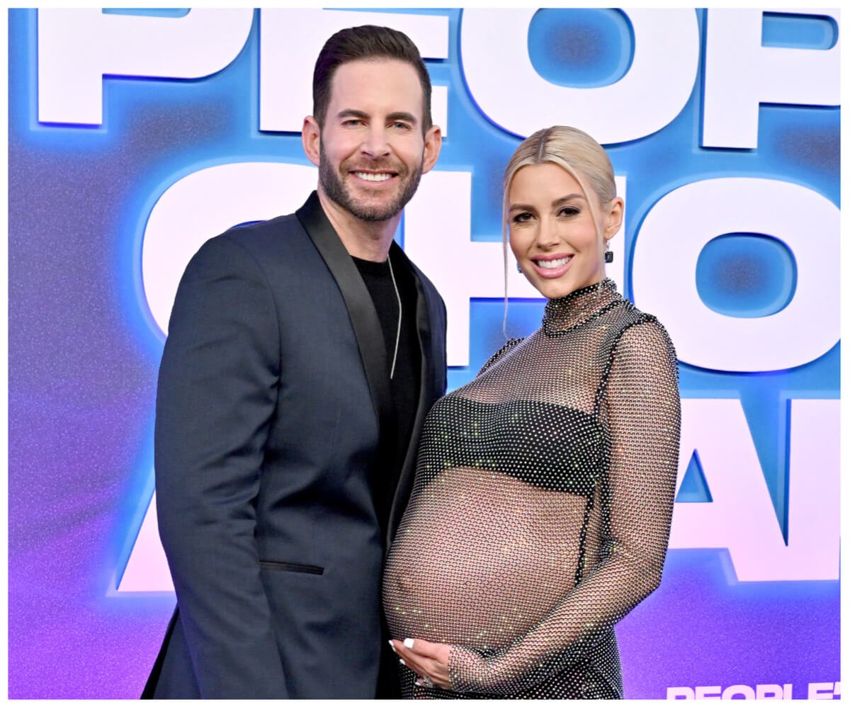 Tarek El Moussa and Heather Rae El Moussa pose together at an event.