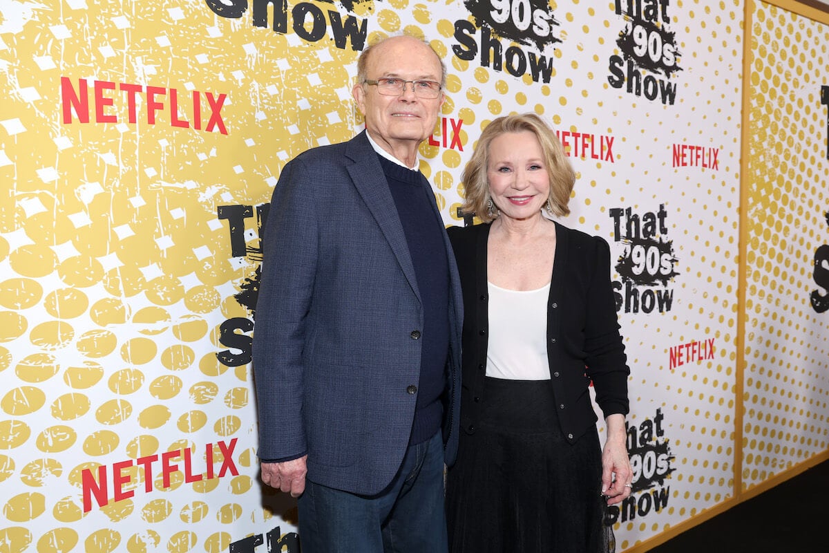 That '90s Show actors Kurtwood Smith and Debra Jo Rupp standing