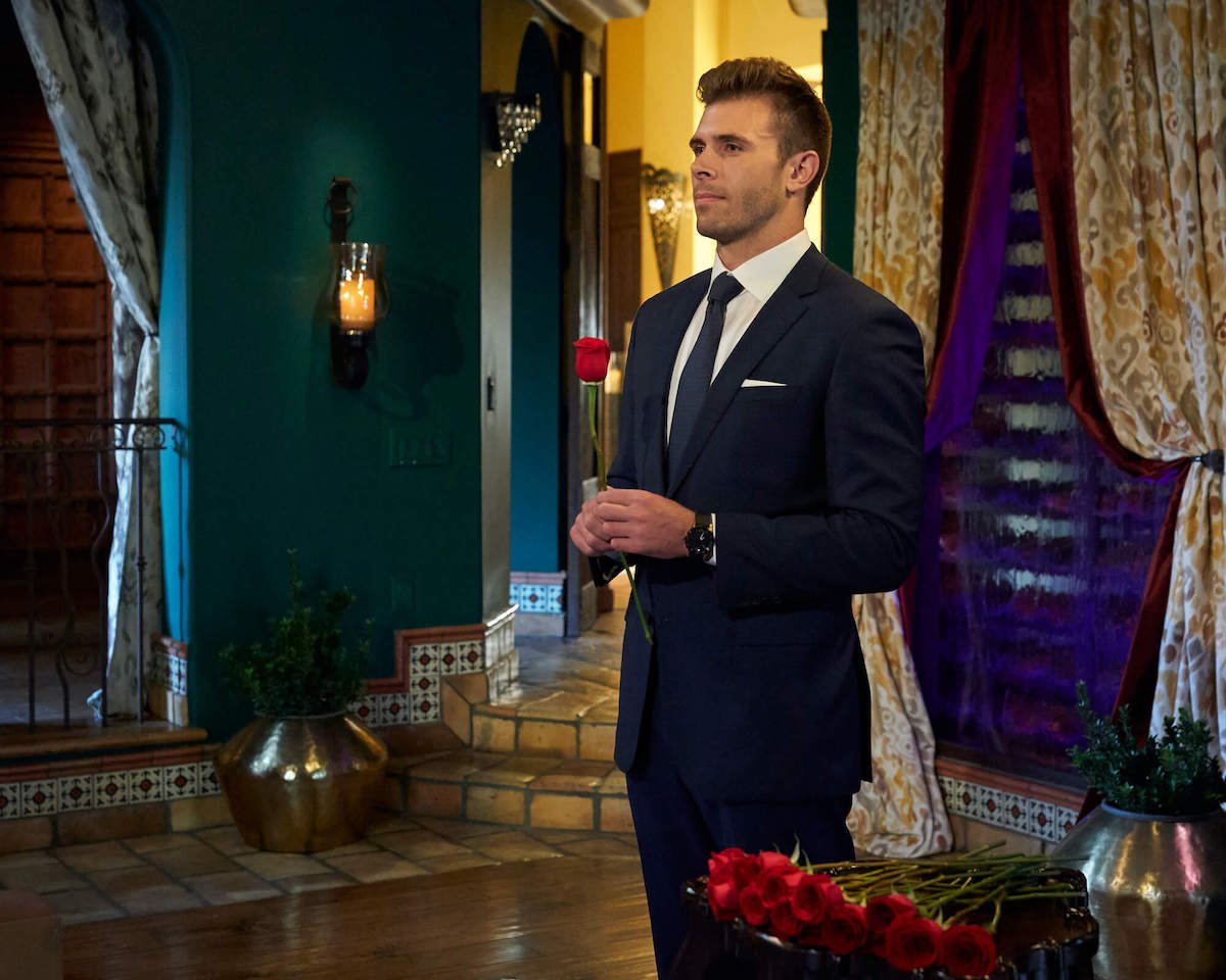 'The Bachelor' season 27 lead Zach Shallcross holding a rose at a rose ceremony