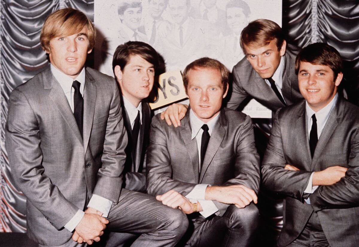 The Beach Boys in 1964 wearing gray suits: Dennis Wilson, Brian Wilson, Mike Love, Al Jardine and Carl Wilson