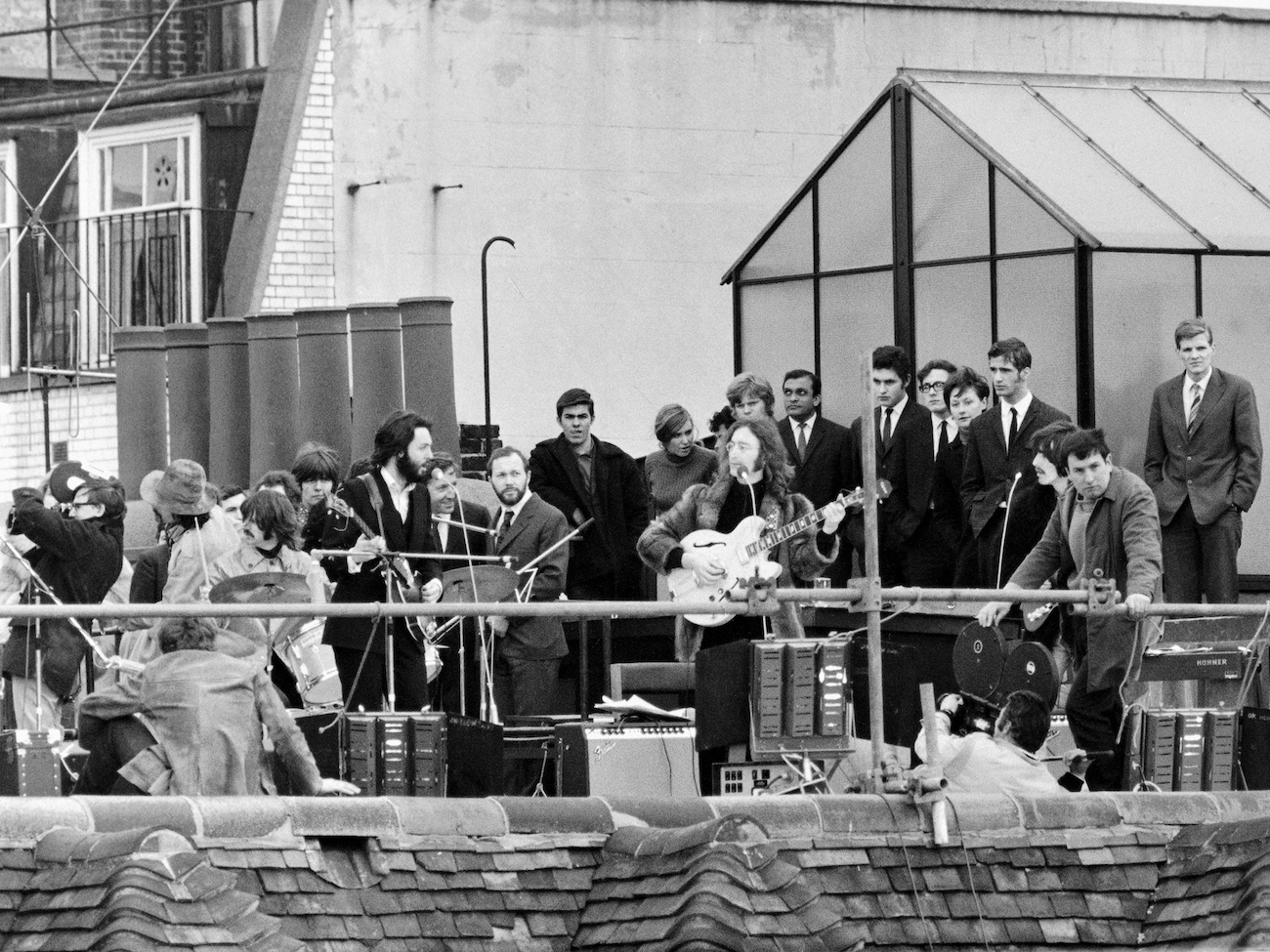 The Beatles performing on the rooftop of Apple Headquarters in 1969.