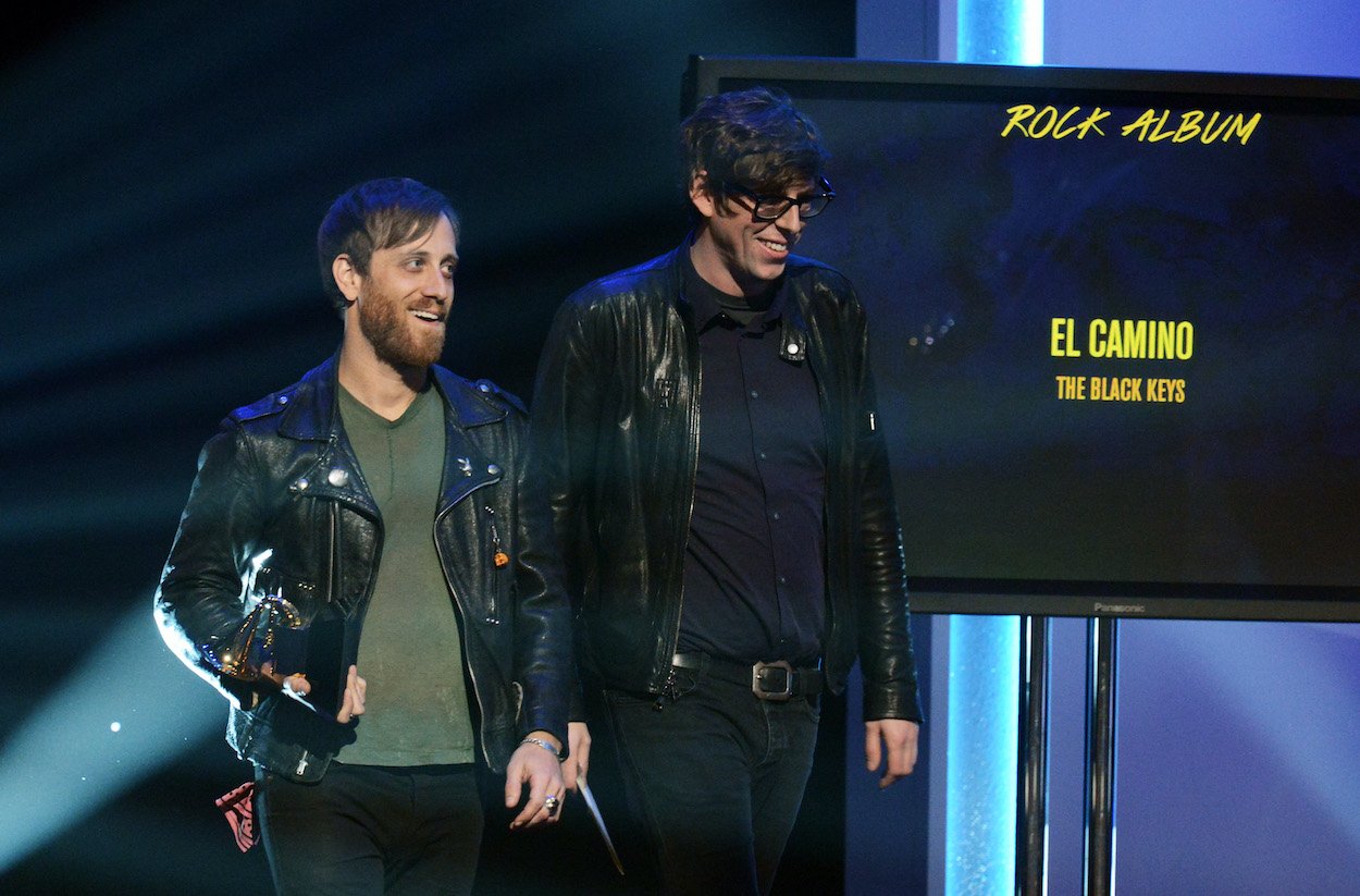 Dan Auerbach and Patrick Carney of The Black Keys walk on stage after they win for Best Rock Album at the 2013 Grammy Awards.