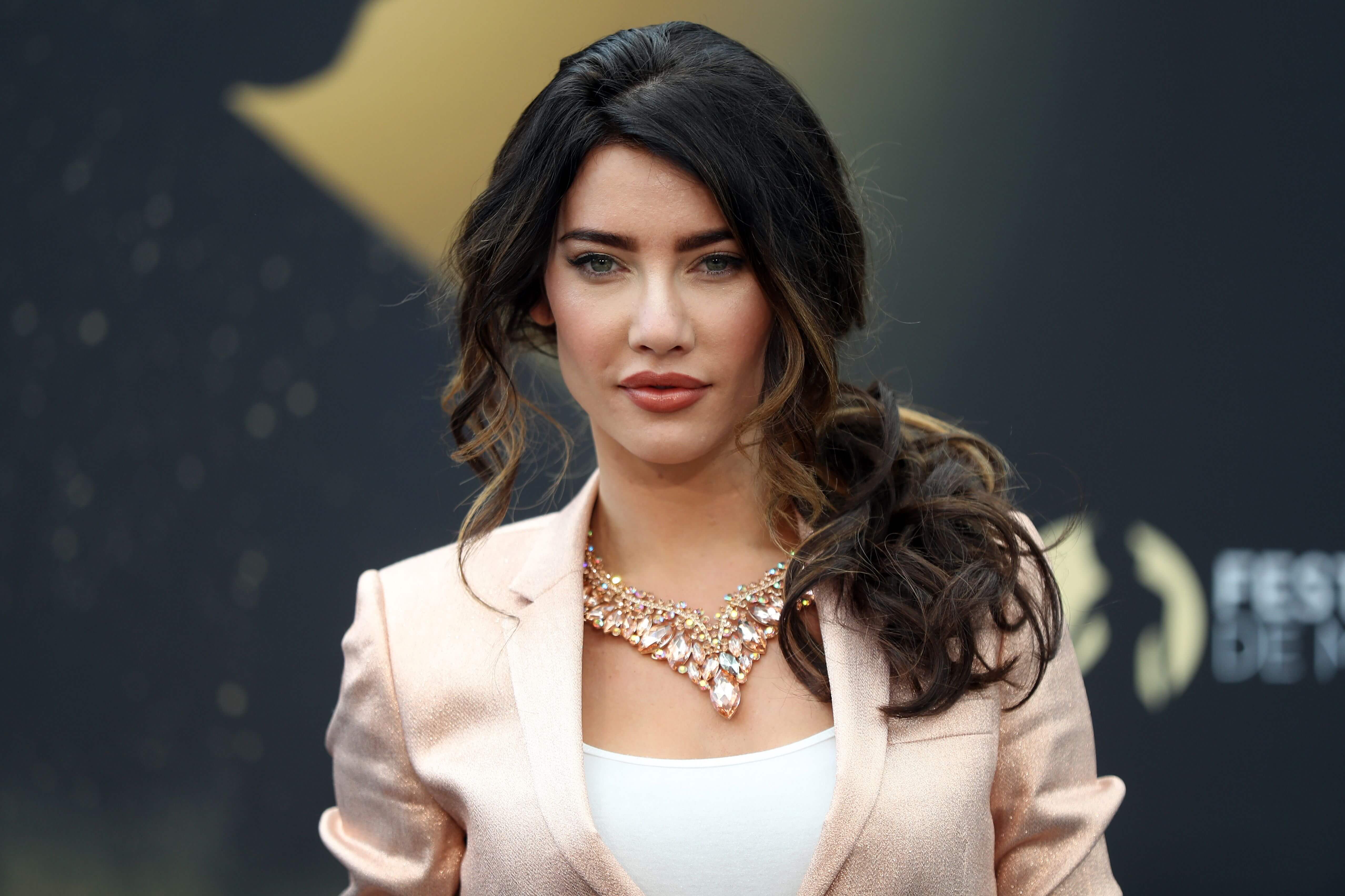 'The Bold and the Beautiful' star Jacqueline MacInnes Wood in a pink suit; poses on the red carpet.