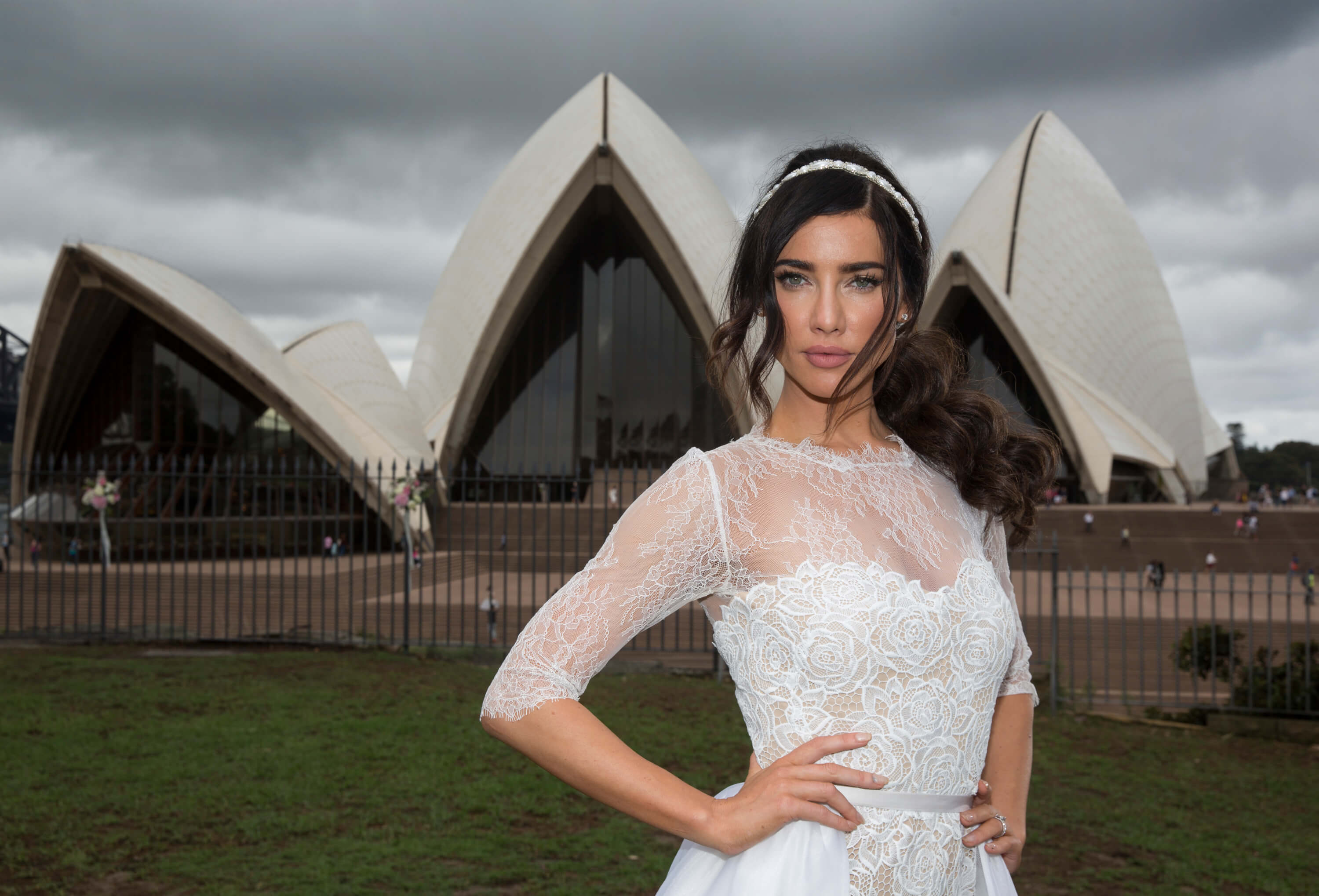 'The Bold and the Beautiful' star Jacqueline MacInnes Wood in a wedding dress; posing in front of the Sydney Opera House.