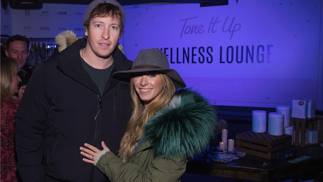 Evan Starkman and wife Rachael Braun pose for a photo in the Tone It Up Wellness Lounge during the Sundance Film Festival
