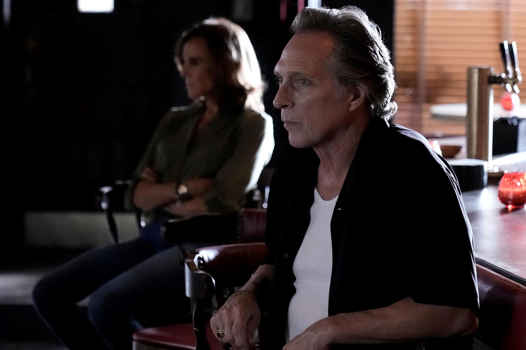 William Fichtner, in character as Leo Nicoletti in 'The Company You Keep' on ABC, wears a black short-sleeved button-up shirt over a white shirt.