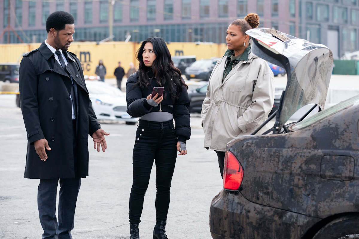 Dante, Mel, and Robyn standing near a car in 'The Equalizer' Season 3 Episode 8