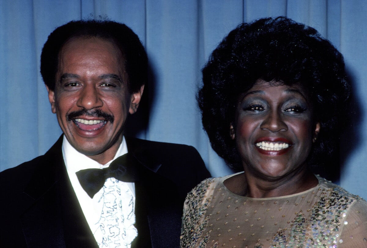 Actors Sherman Hemsley and Isabel Sanford standing next to eachother