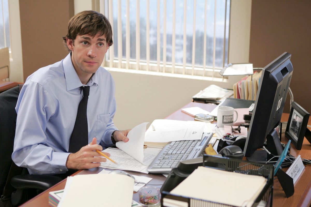 'The Office': John Krasinski sits at Jim Halpert's desk doing paperwork