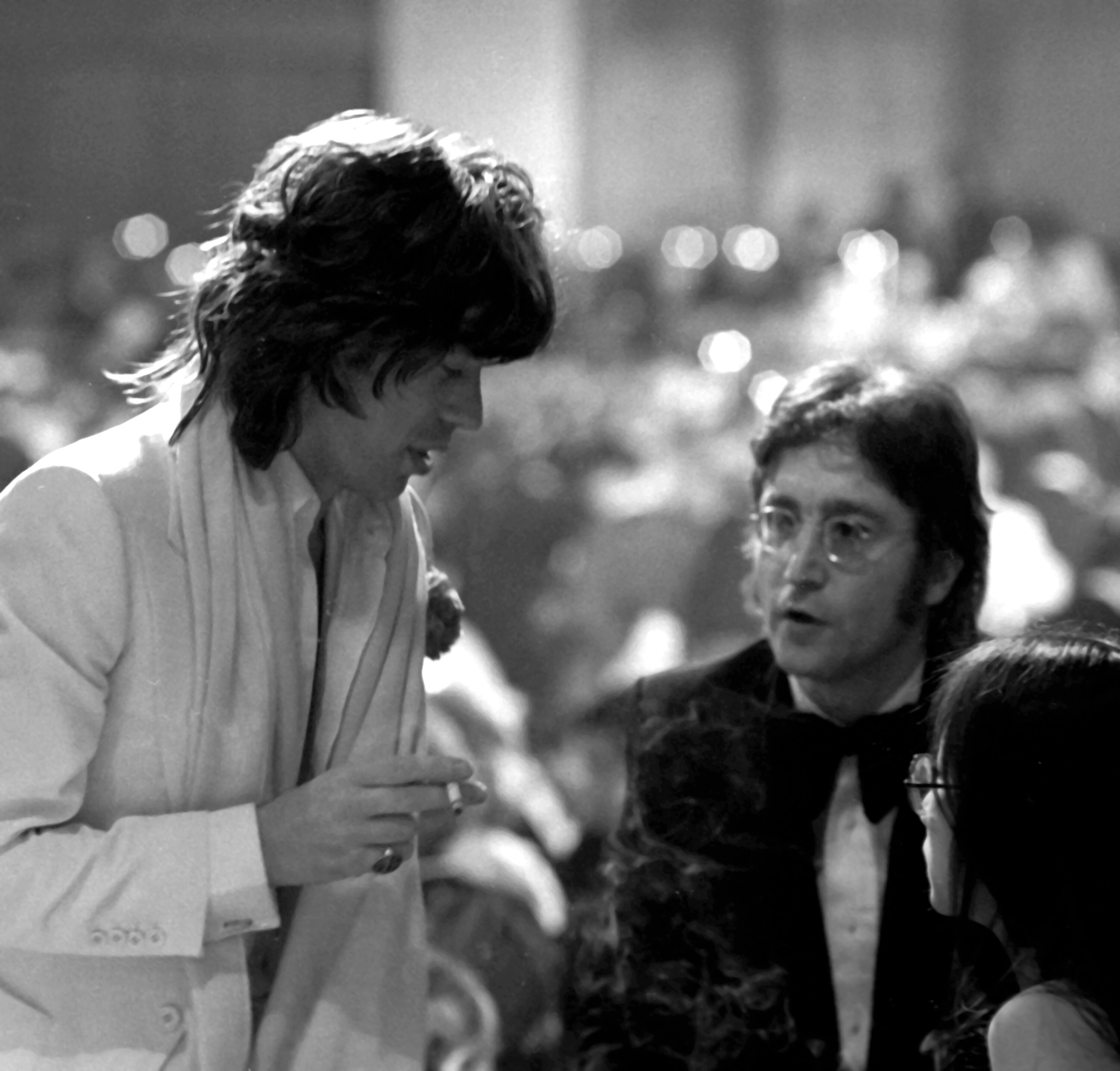 Mick Jagger and John Lennon in suits