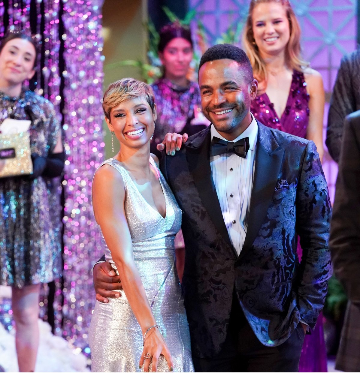 'The Young and the Restless' star Brytni Sarpy in a silver dress and Sean Dominic in a blue suit; pose together during a scene.