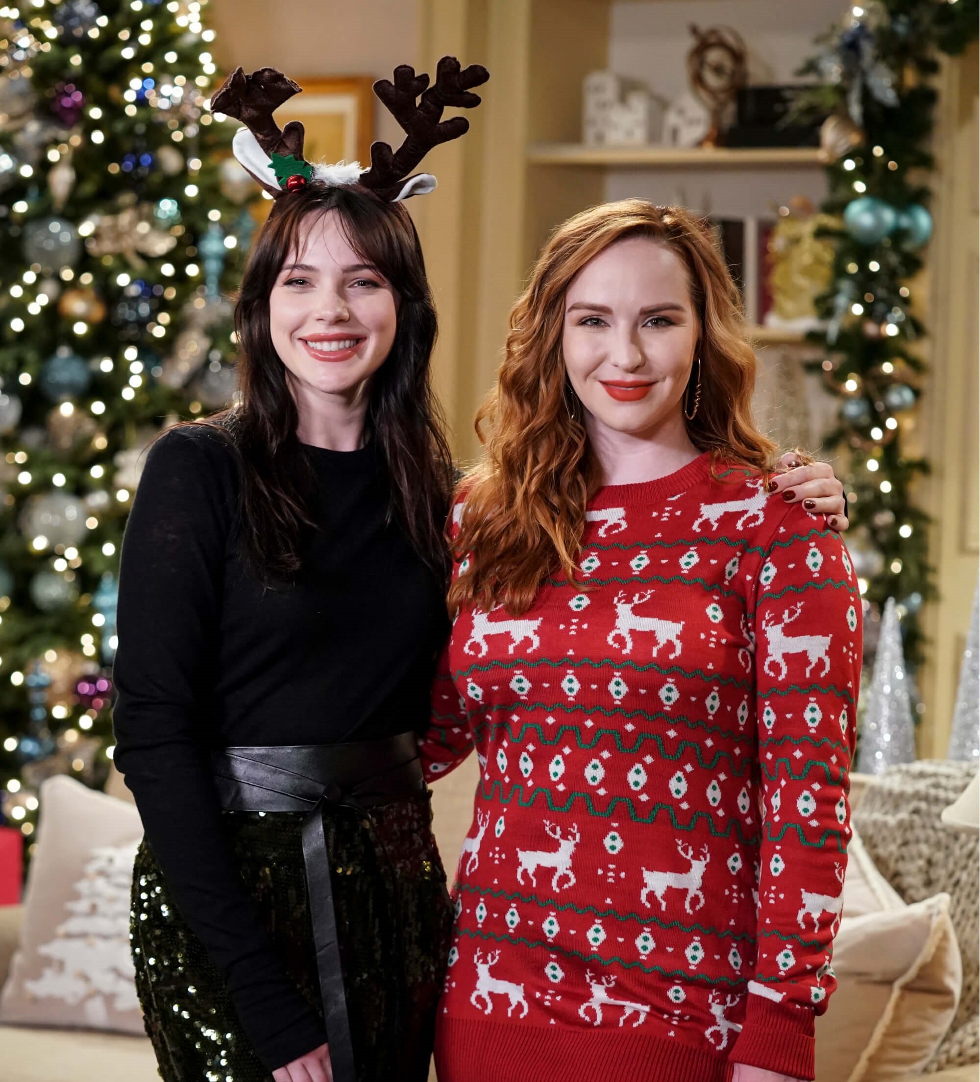 'The Young and the Restless' stars Cait Fairbanks and Camryn Grimes posing together during a Christmas scene.