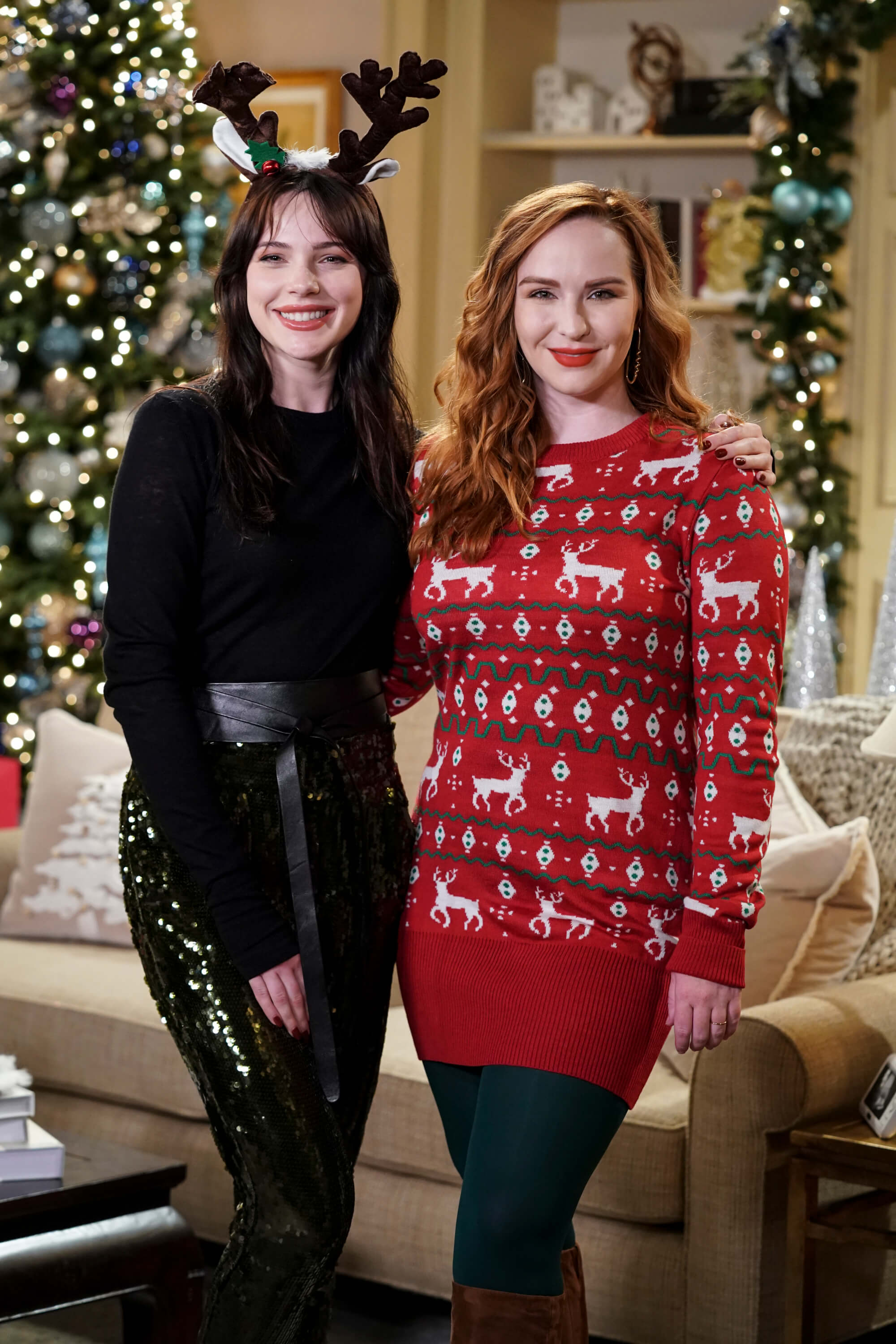 'The Young and the Restless' stars Cait Fairbanks and Camryn Grimes posing together during a Christmas scene.