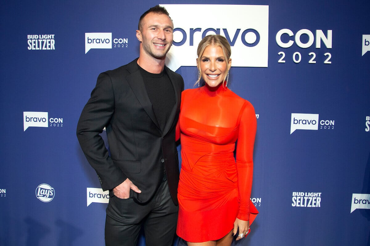 Tracy Tutor and boyfriend Erik Anderson smile on the red carpet