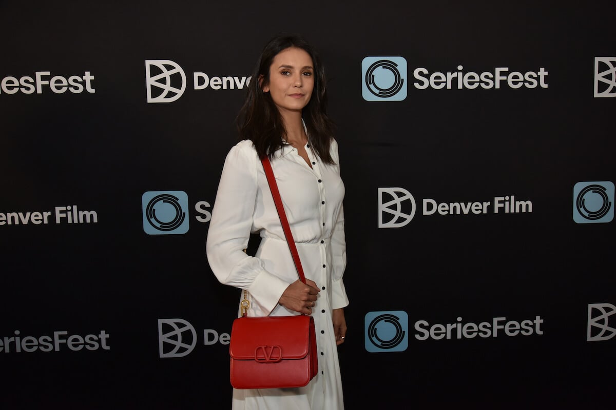 'Vampire Diaries' Katherine actor Nina Dobrev holds a red purse at SeriesFest